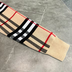 Beige knit plaid hoodie sleeve and hem with black, red, and striped pattern