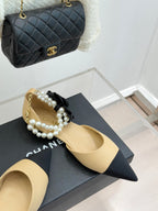 Chanel pointed flats in beige with black bow and faux pearl ankle strap