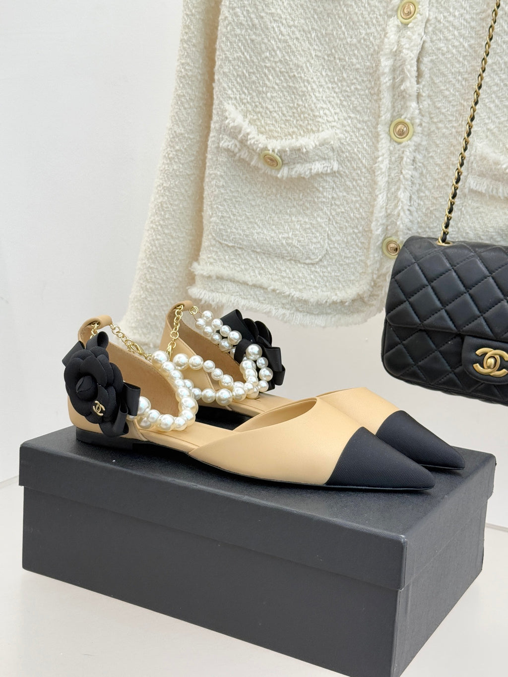Chanel ladies flats, beige pointed-toe with black bows and faux pearl straps