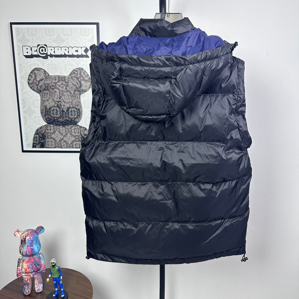 Moncler long puffer jacket back view, dark quilted puffer, hood, blue shoulder lining
