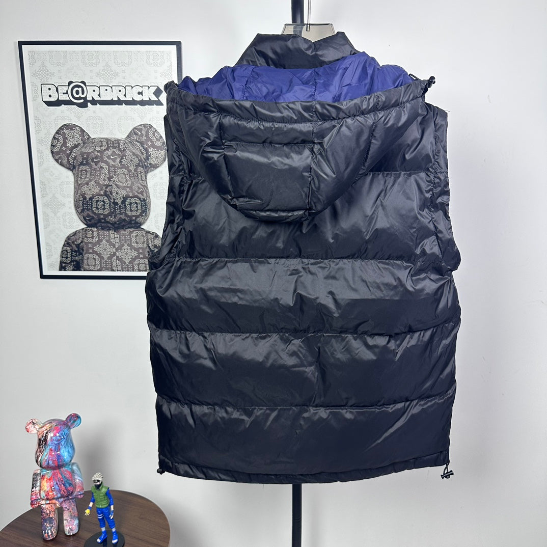 Moncler long puffer jacket back view, dark quilted puffer, hood, blue shoulder lining