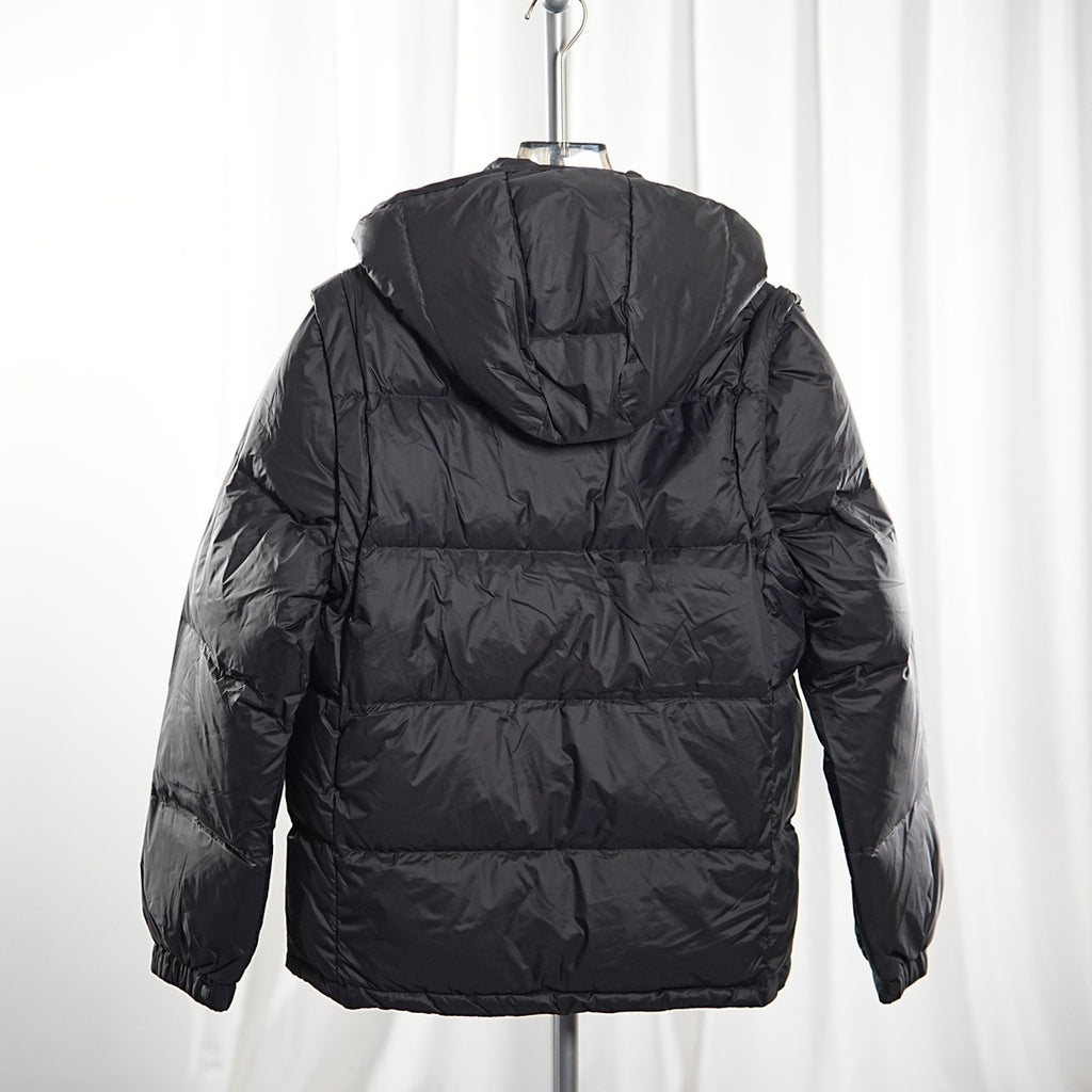 Moncler long puffer jacket back view, dark quilted puffer with hood, zip at center