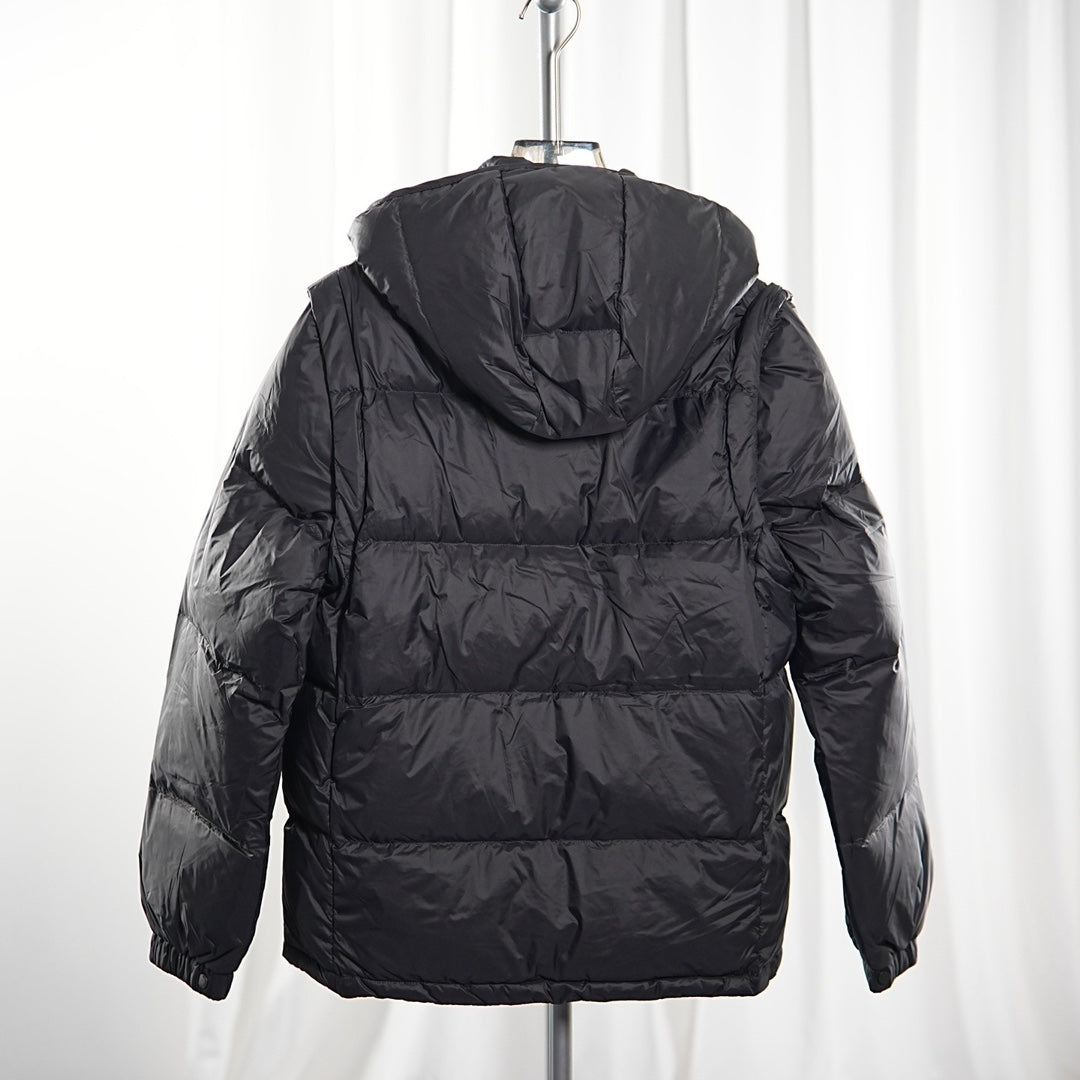 Moncler long puffer jacket back view, dark quilted puffer with hood, zip at center