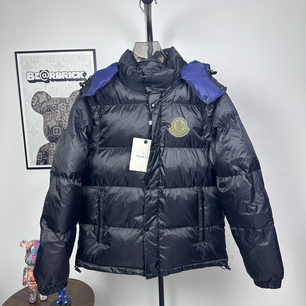 Moncler long puffer jacket with hood, dark shell, quilted panels, zip front, logo badge