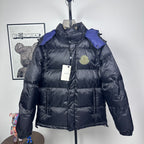 Moncler long puffer jacket with hood, dark shell, quilted panels, zip front, logo badge