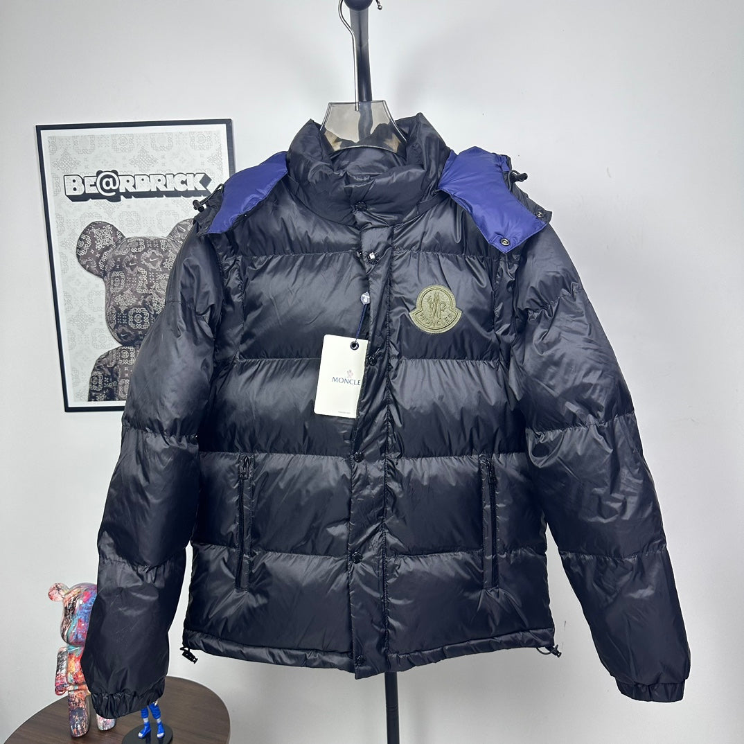 Moncler long puffer jacket with hood, dark shell, quilted panels, zip front, logo badge