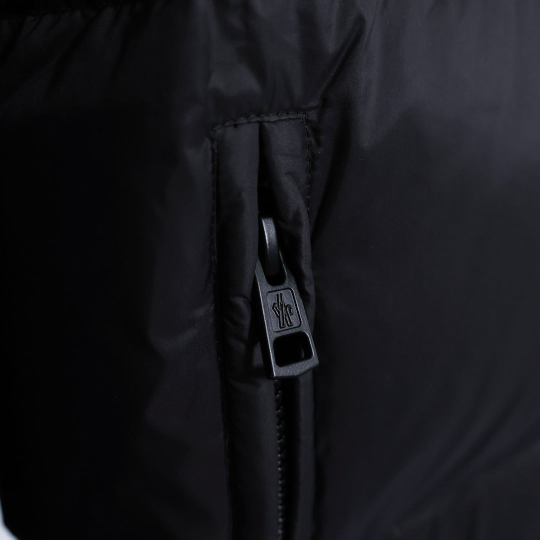 Moncler jacket zipper pull and logo label inside pocket opening