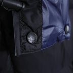 Moncler logo patch on jacket chest near blue inner lining