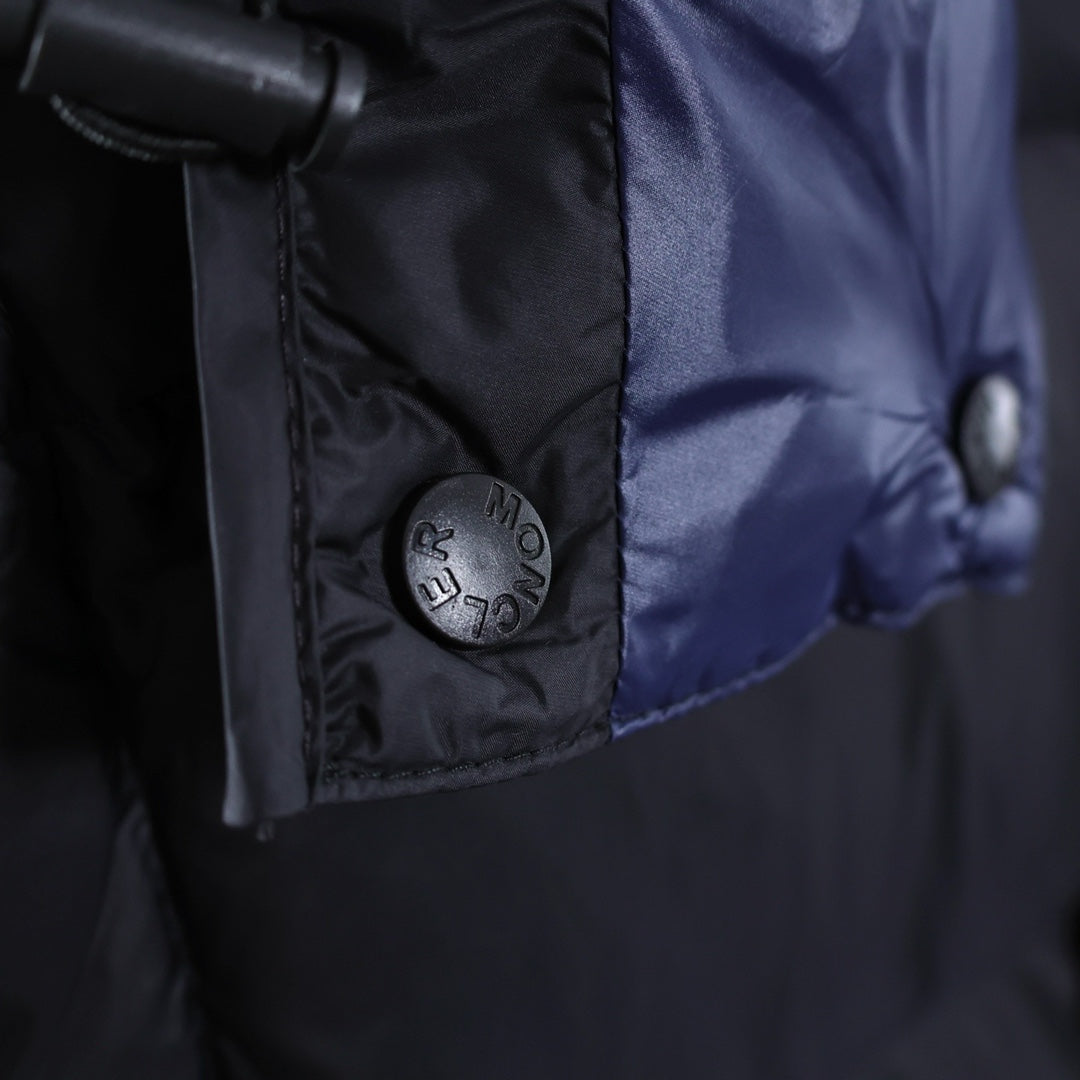 Moncler logo patch on jacket chest near blue inner lining