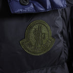 Moncler logo patch on dark puffer jacket chest panel