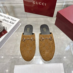 Gucci unisex GG-pattern mules with gold horsebit detail and dark insoles