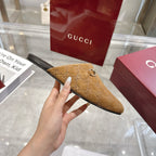 Gucci unisex GG-pattern mule with gold horsebit, tan upper, side close-up