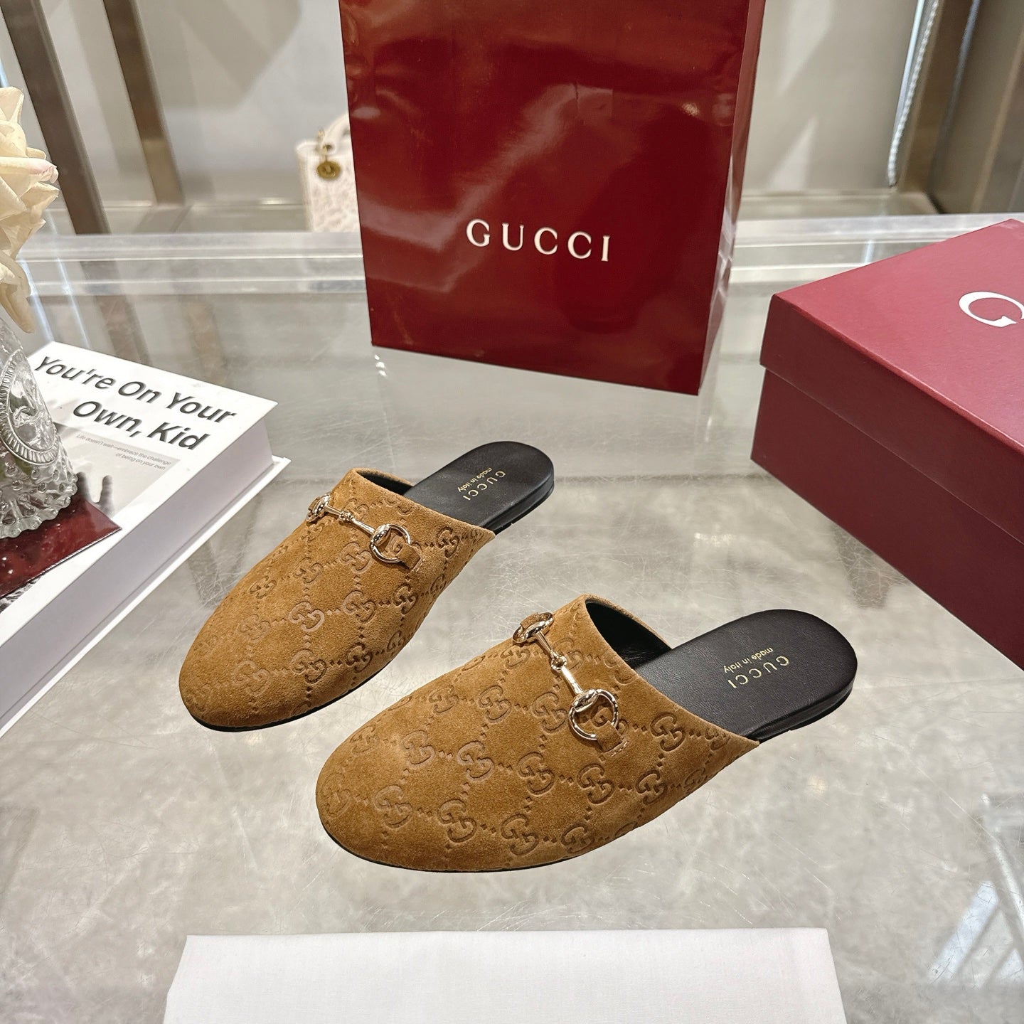 Gucci unisex GG-pattern mules with gold horsebit detail, tan upper, side view
