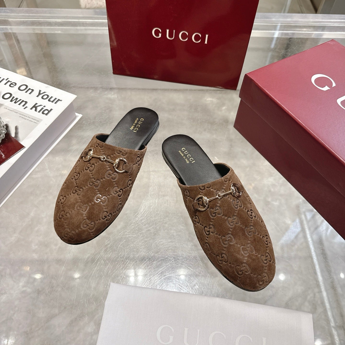 Gucci unisex mules with GG monogram upper, gold-tone horsebit detail, dark brown