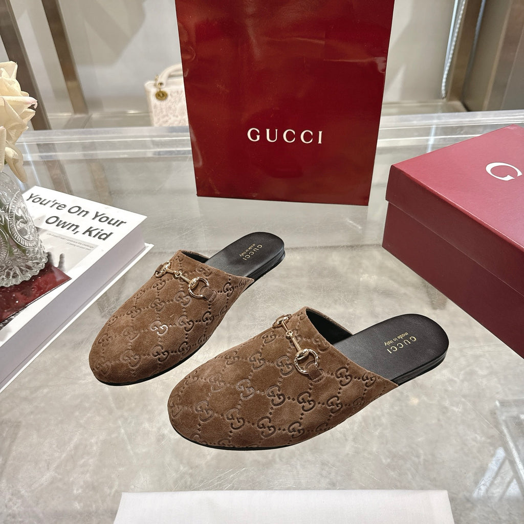 Gucci unisex mules pair with GG monogram fabric and gold-tone horsebit on brown