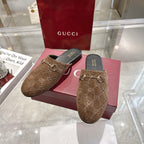 Gucci unisex mules with GG monogram upper and gold-tone horsebit detail, brown