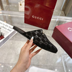 Gucci unisex mule slide, black GG fabric with gold-tone horsebit strap, slip-on