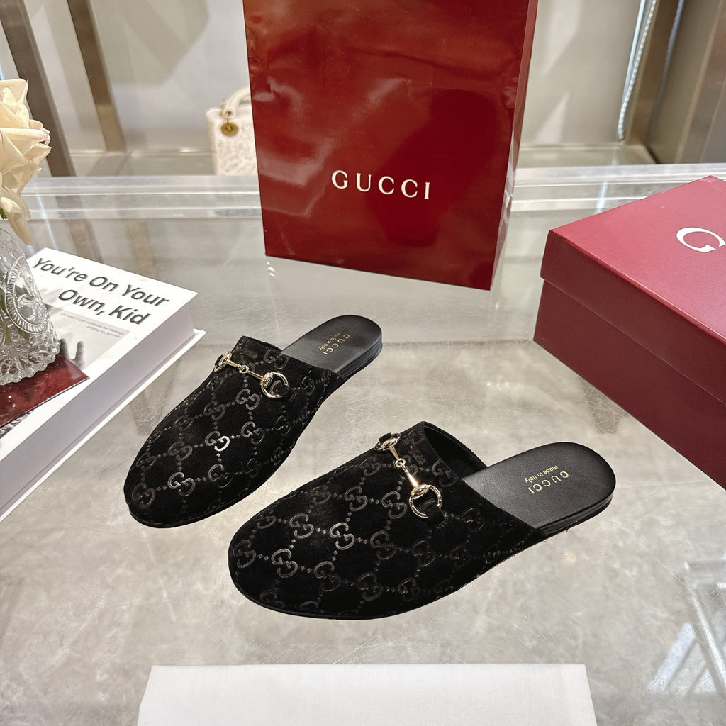 Gucci unisex GG-print mule slides, black fabric with gold horsebit hardware, slip-on