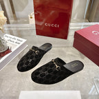 Gucci unisex GG-print mule slides, black fabric with gold horsebit hardware, slip-on