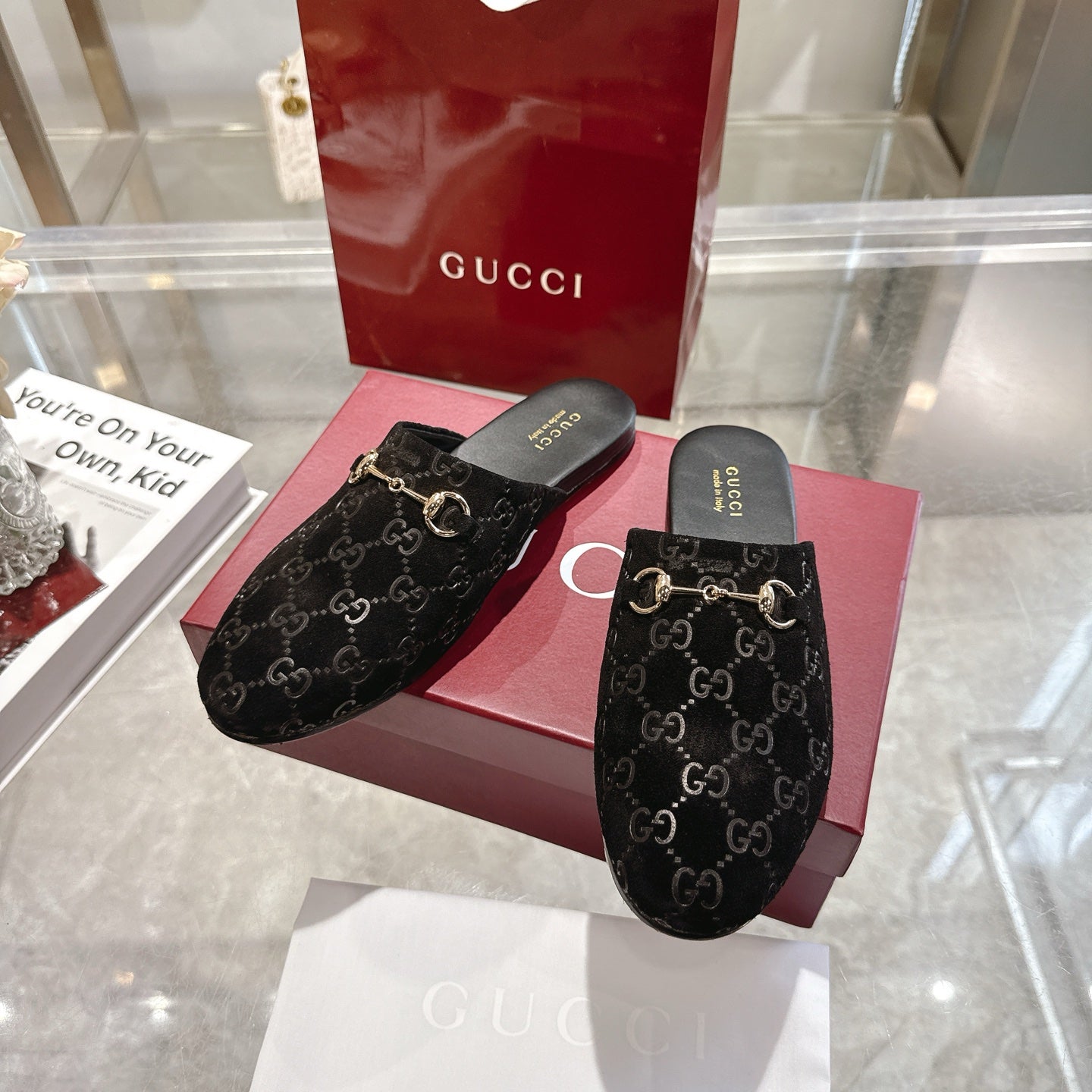 Gucci unisex GG-print mule slides, black with gold horsebit hardware and dark footbeds