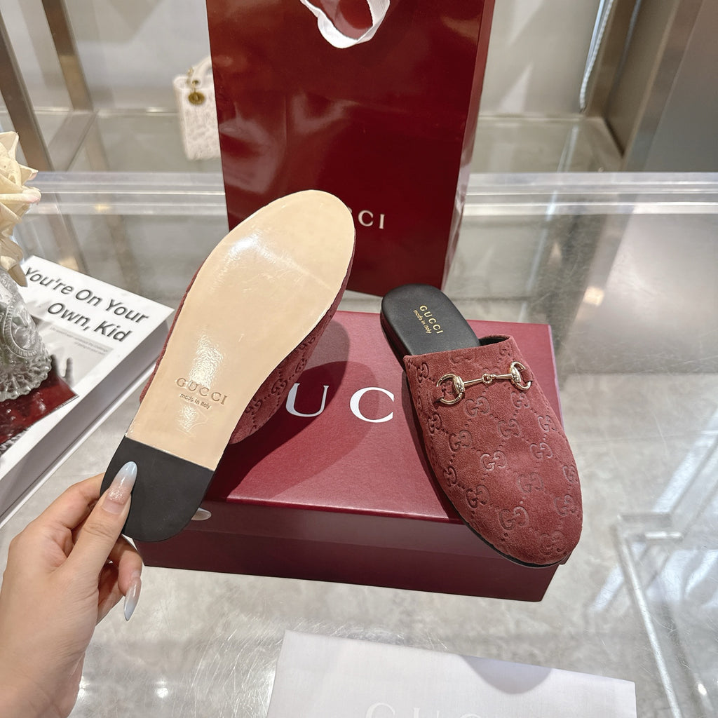 Gucci unisex luxury shoes, red-brown GG embossed mule shown with outsole and black insole
