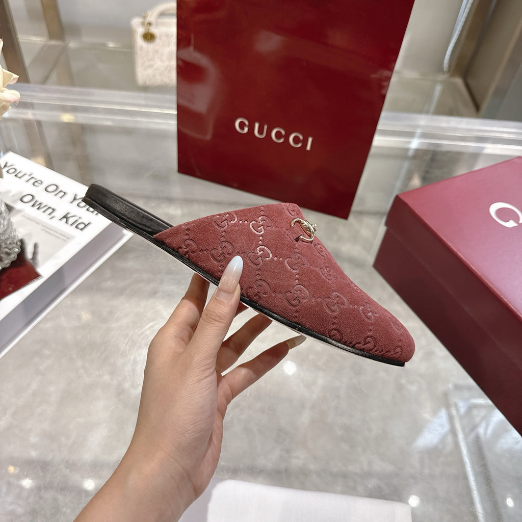 Gucci unisex luxury shoes, red-brown GG embossed mule side view with gold horsebit