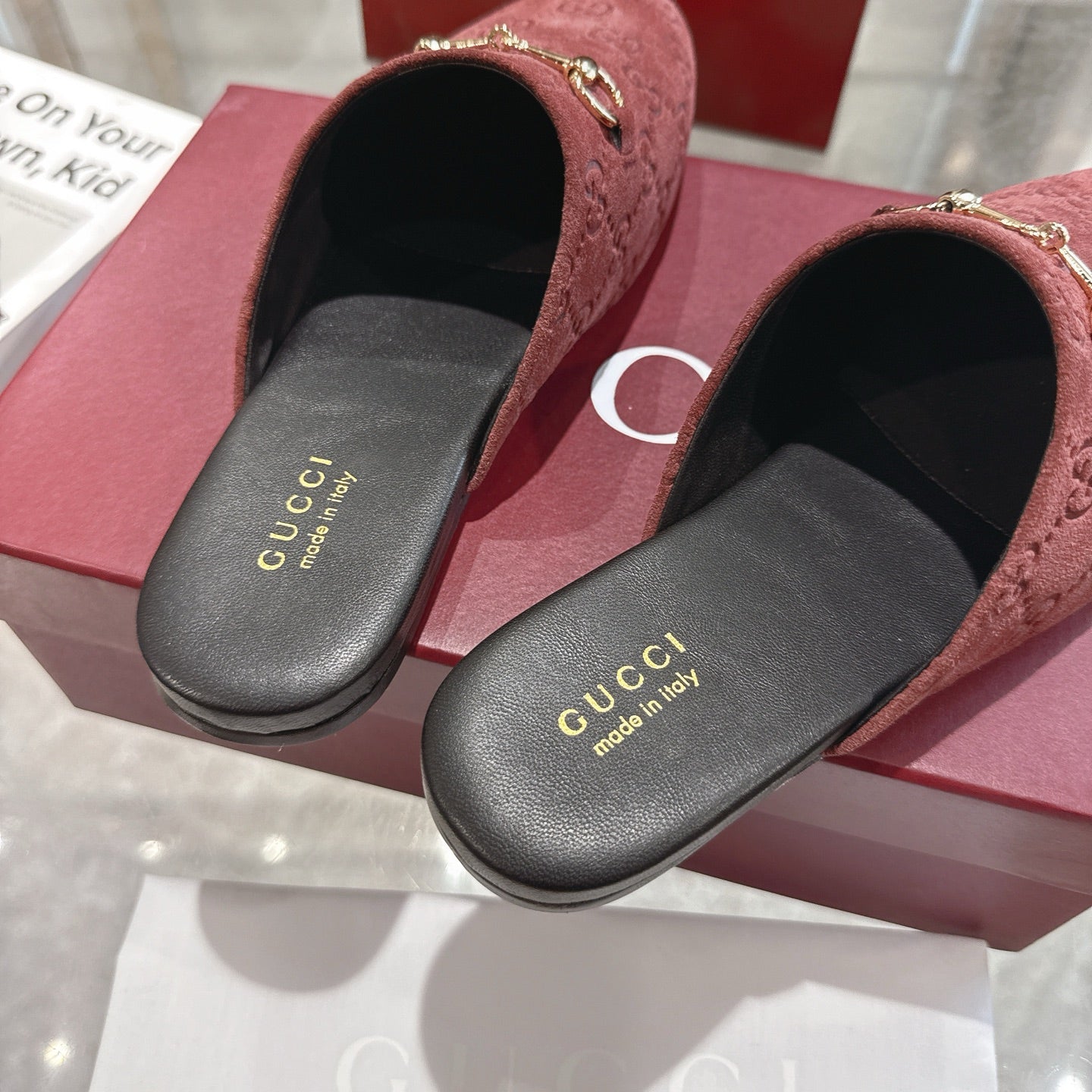 Gucci unisex luxury shoes, red-brown GG embossed mules with black insides and gold trim