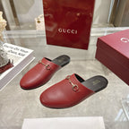 Gucci unisex mules in burgundy leather with gold horsebit detail, black footbed