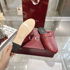 Gucci unisex loafers: burgundy leather with gold horsebit, sole and side view