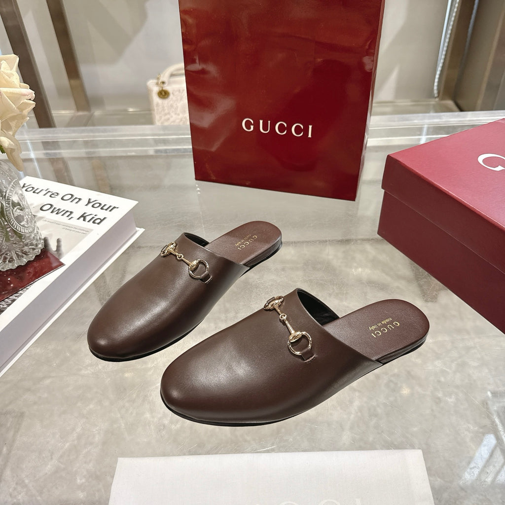 Gucci unisex brown leather slip-on loafers with gold horsebit hardware, low profile.