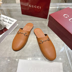 Gucci tan leather slip-on mules with gold-tone horsebit strap