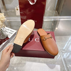 Gucci tan leather mule sandals with visible underside sole