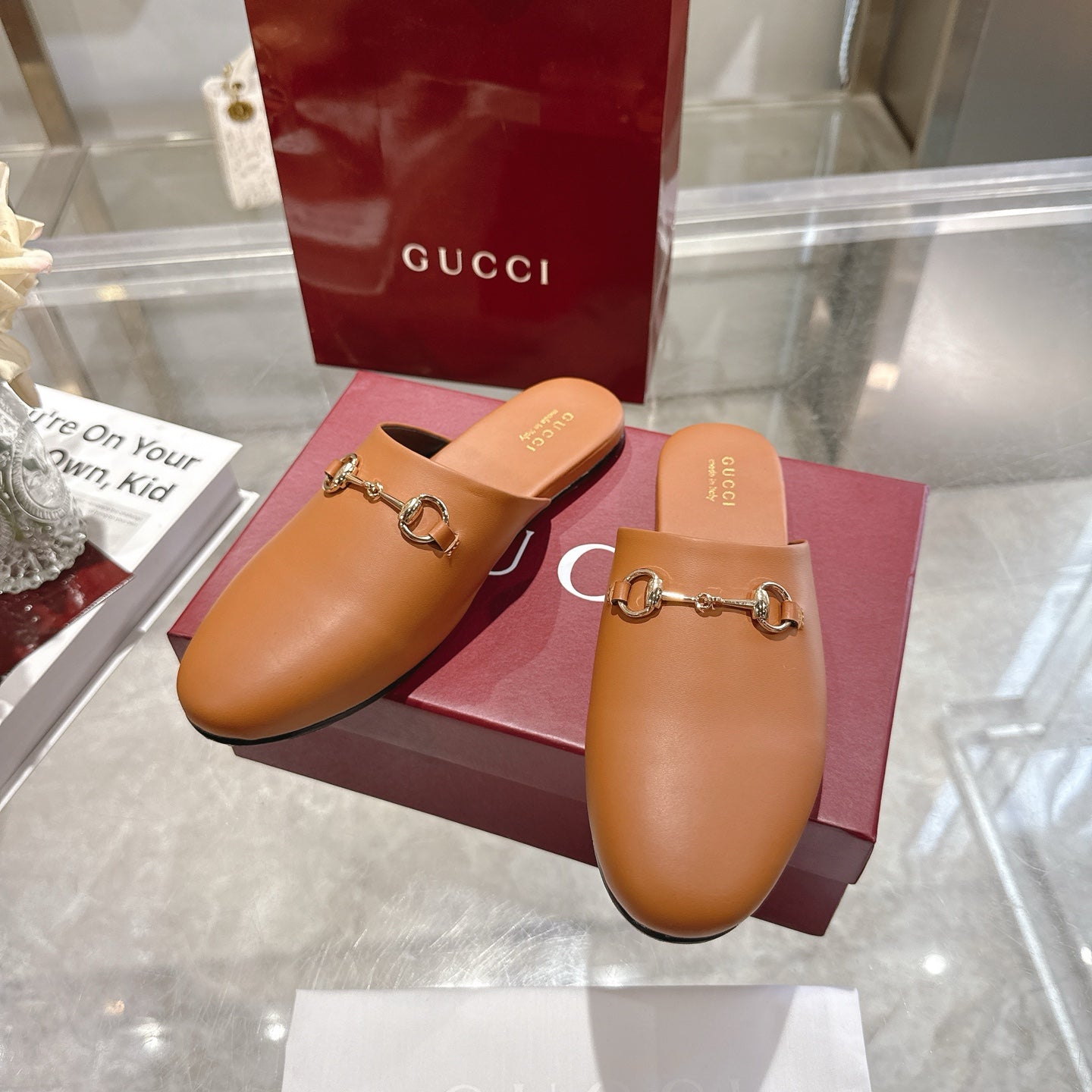Gucci tan leather mules with gold-tone horsebit detail, pair view