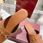 Gucci tan leather mule with branded footbed and gold-tone horsebit detail