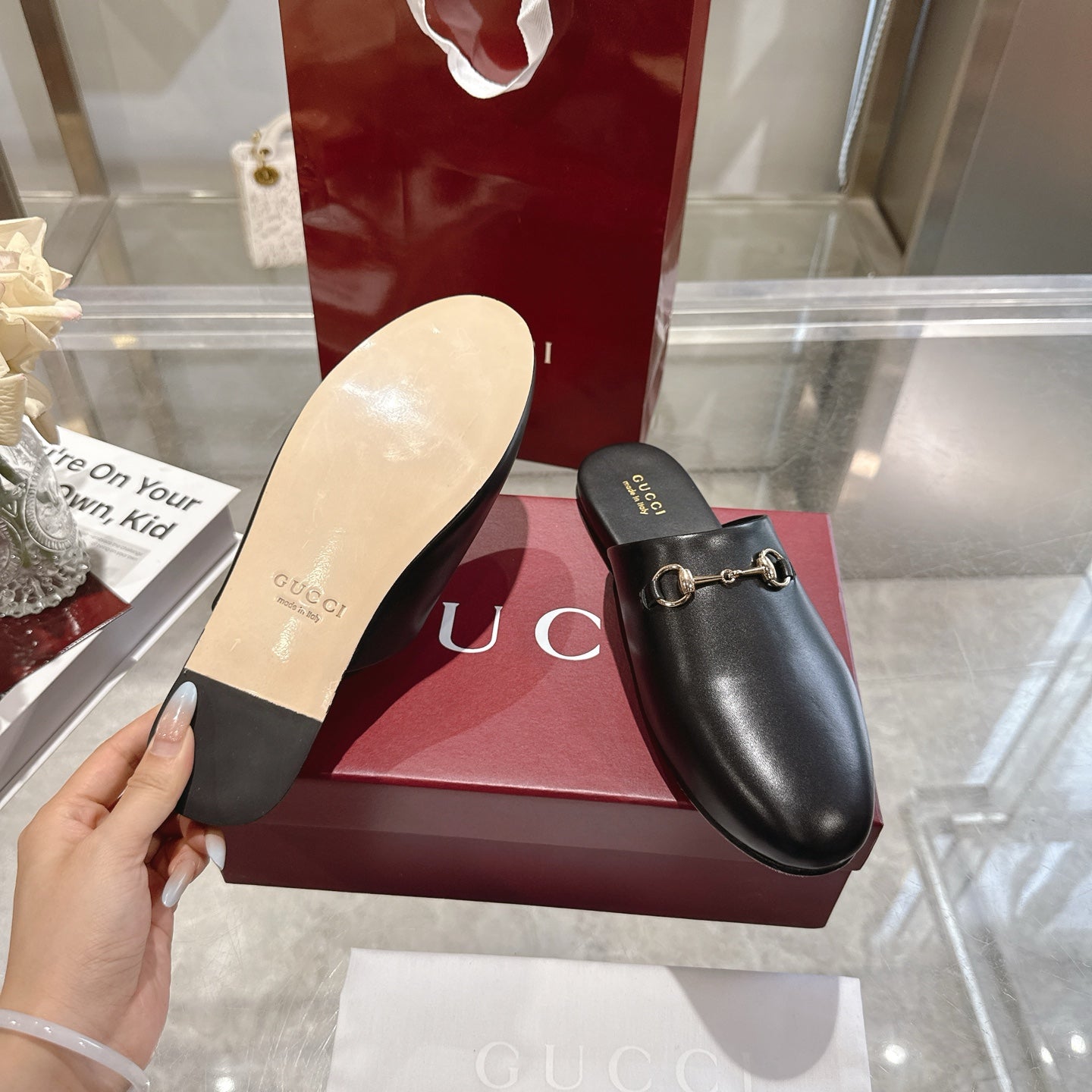 Gucci black leather horsebit mules, outsole visible, slip-on with gold-tone hardware