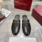 Gucci black leather horsebit mules, slip-on style with gold-tone hardware
