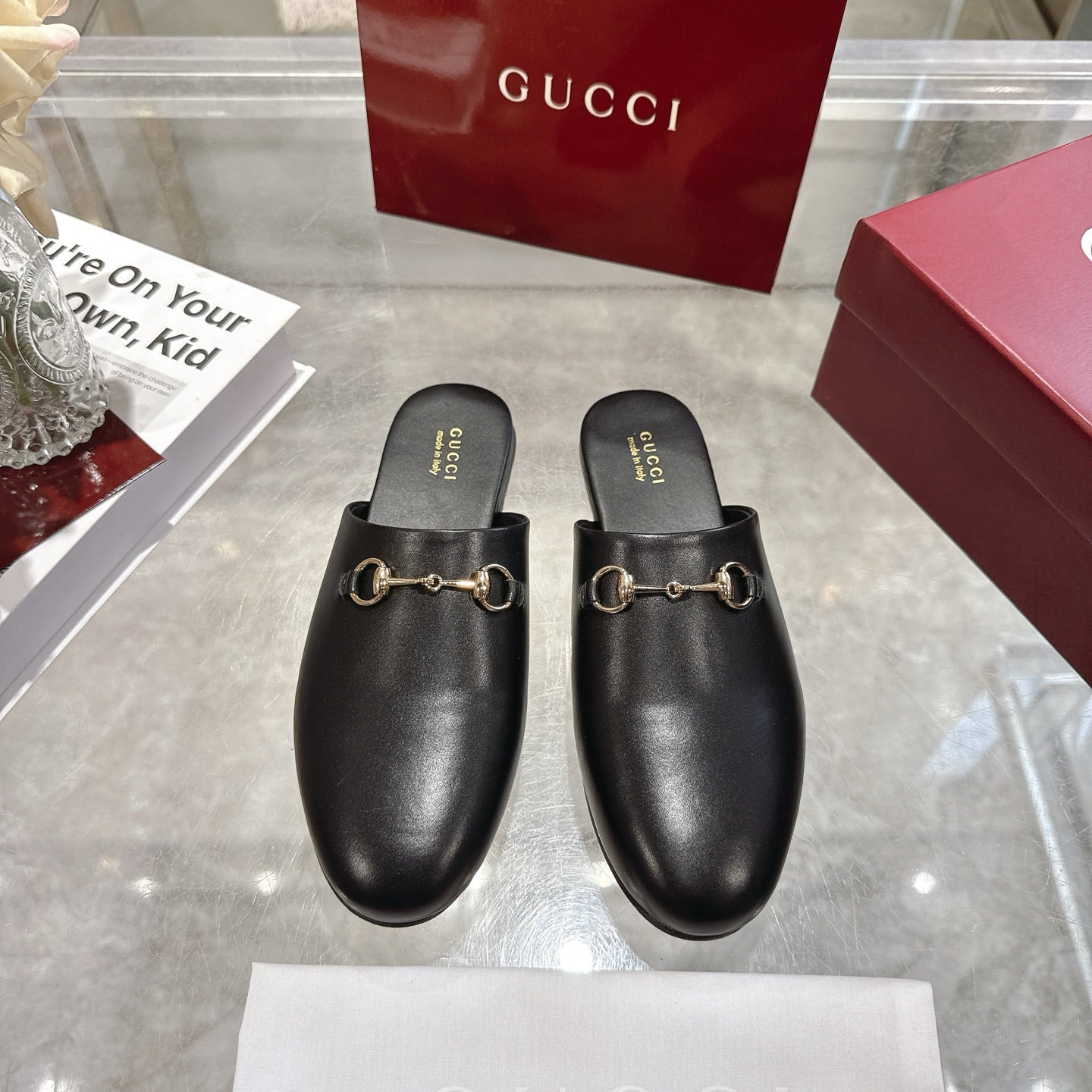 Gucci black leather horsebit mules, slip-on style with gold-tone hardware
