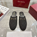 Gucci unisex loafers in dark monogram fabric with gold horsebit on black slip-on mules