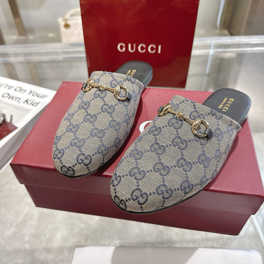 Gucci unisex GG monogram mule slides with gold-toned horsebit detail, front view