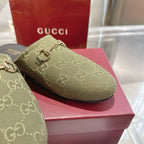 Gucci unisex GG canvas mule shoe, olive close-up of gold-tone horsebit strap