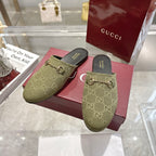 Gucci unisex GG canvas mules, olive with gold-tone horsebit, shown on pink box