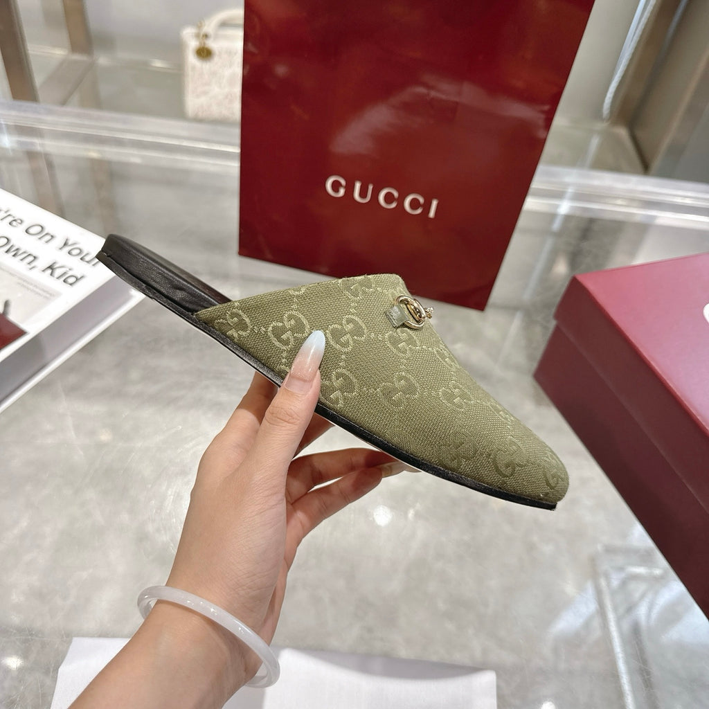 Gucci unisex mule shoe, olive GG canvas with gold-tone horsebit detail, side view