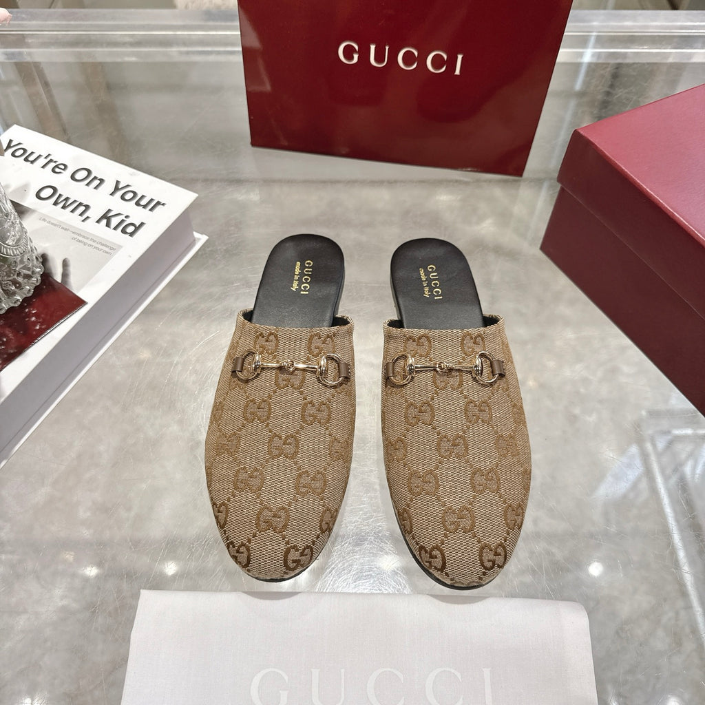 Gucci unisex mules with GG canvas print and metal horsebit detail