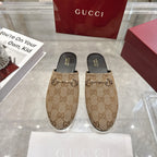 Gucci unisex mules with GG canvas print and metal horsebit detail