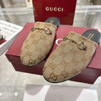 Gucci unisex slide mules with GG monogram canvas and gold horsebit