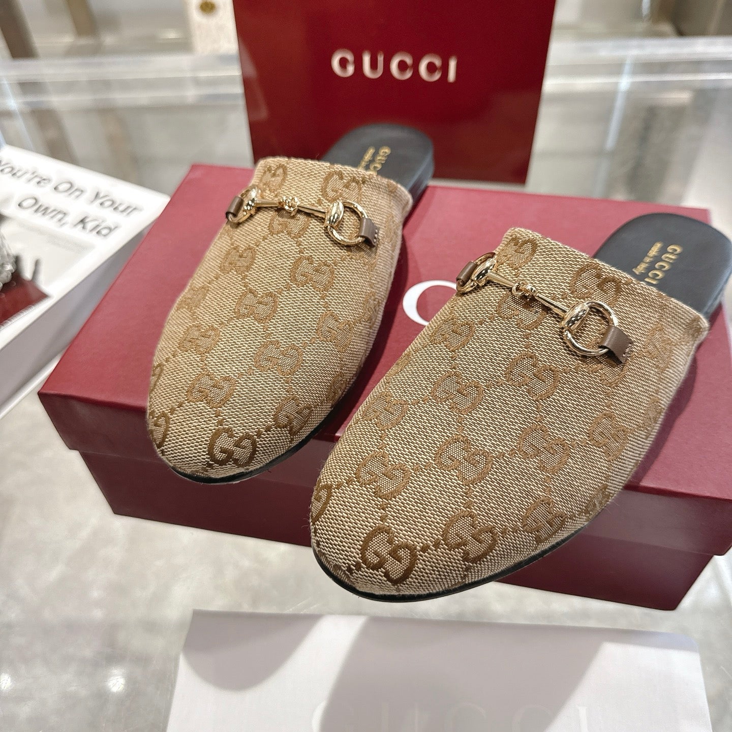 Gucci unisex slide mules with GG monogram canvas and gold horsebit