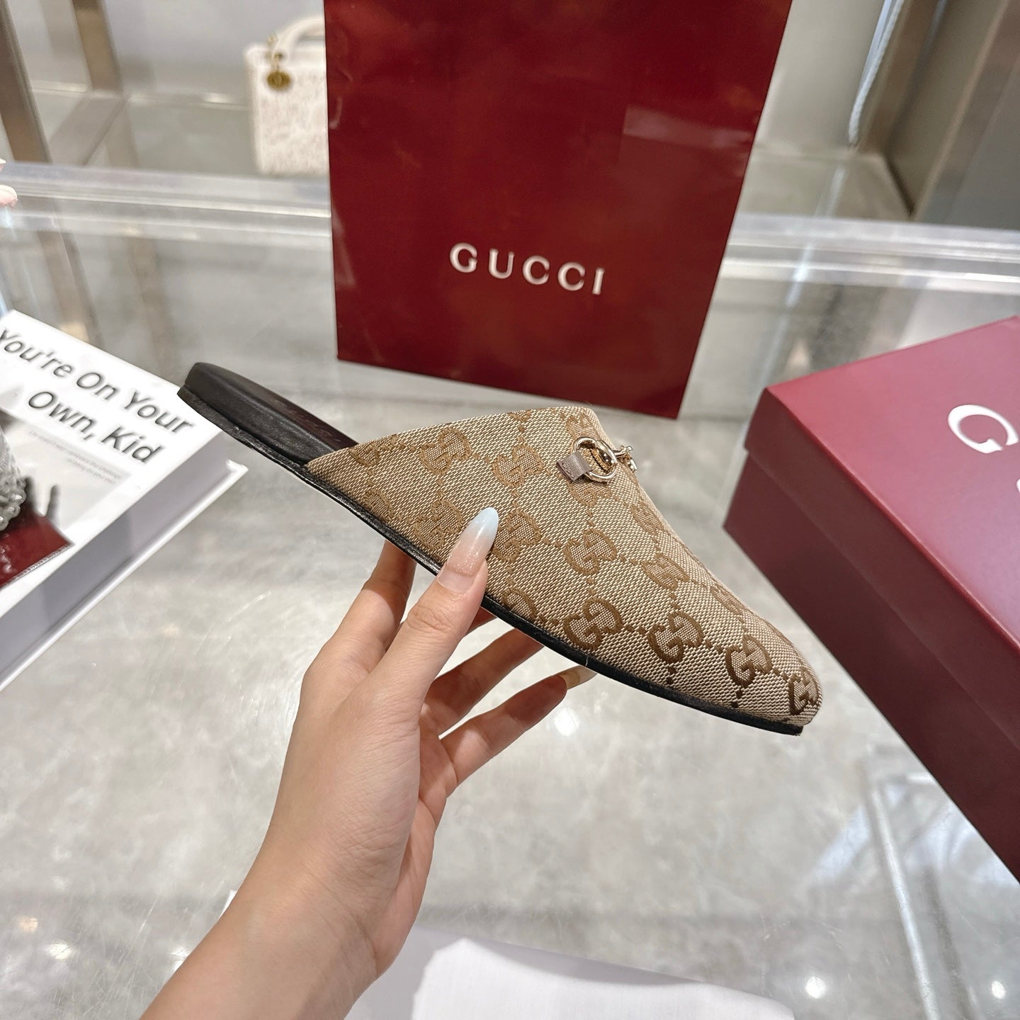 Gucci unisex mule with GG monogram canvas upper and dark sole