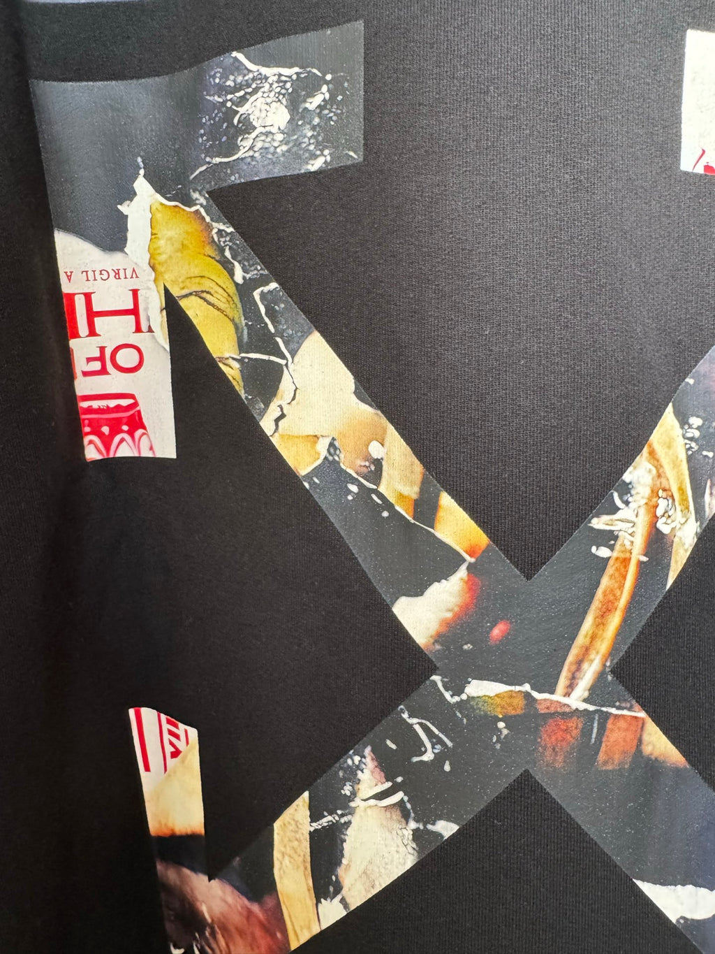 Off-White hoodie, black, close-up of large X graphic and photo-style print elements