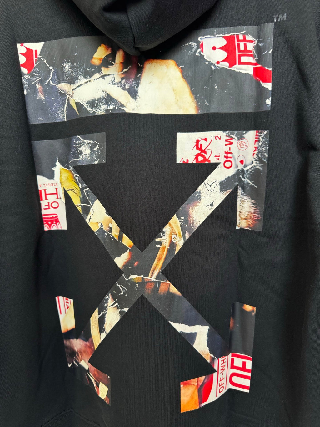 Off-White hoodie, black, close-up of hooded graphic artwork and red branding patches