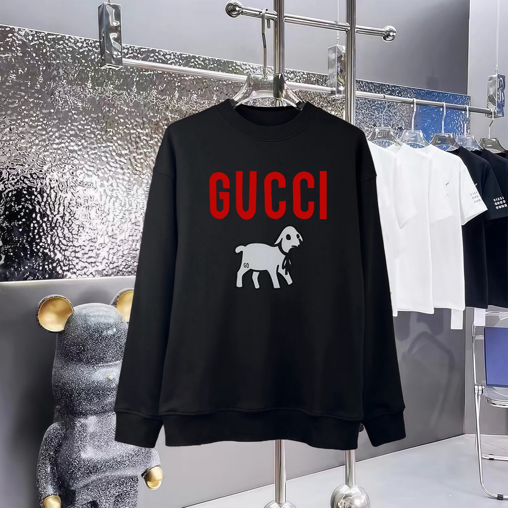 Black sweatshirt with GUCCI logo and cartoon dog graphic, crew neck, long sleeves